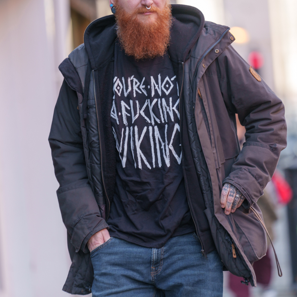 black teeshirt that says you're not a f*cking viking in norse font